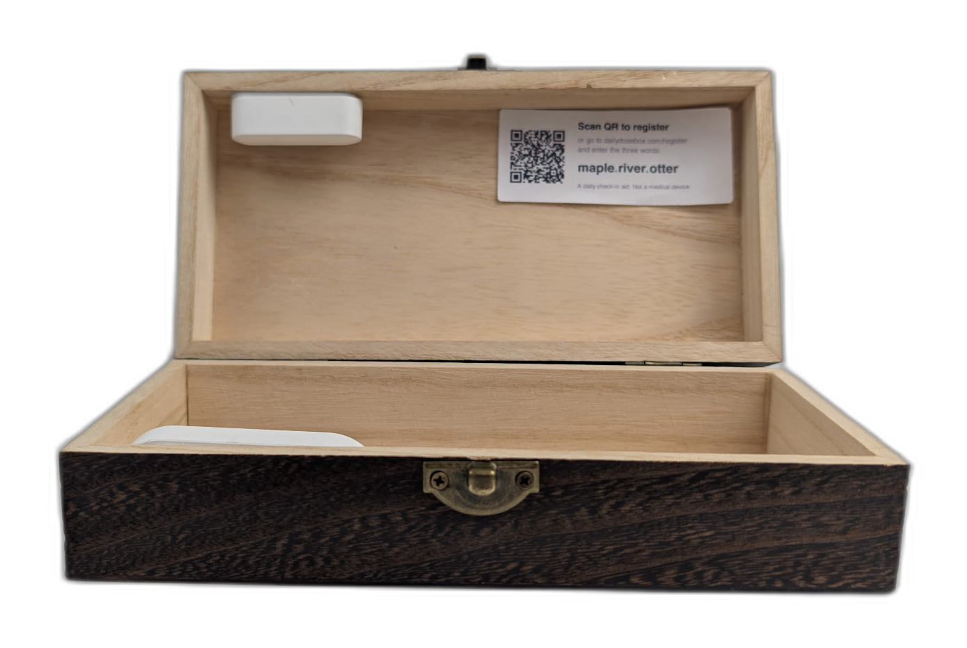 DailyDoseBox open, showing the lid sensor and setup code inside